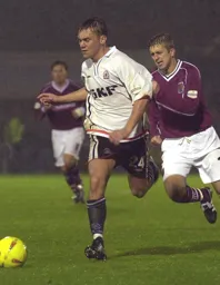 Sol Davies goes past his man