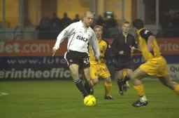 Paul Hughes dribbles the ball
