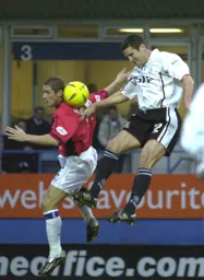 Chris Coyne jumps highest for the ball