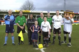 Kevin Nicholls with mascot vs Wycombe