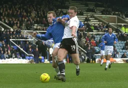 Steve Howard being strong to win the ball