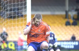Kevin Nicholls cups his ear