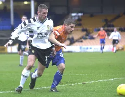 Dean Crowe tries to beat his marker