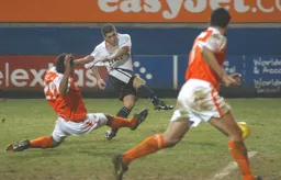 Dean Crowe strikes the ball