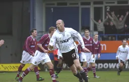 Paul Hughes turns in celebration