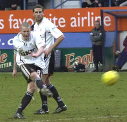 Kevin Nicholls passing the ball forward