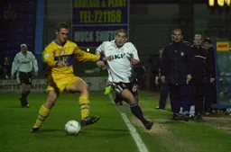 Dean Crowe taking on a defender