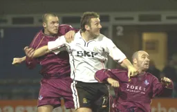 Steve Howard goes up for the ball