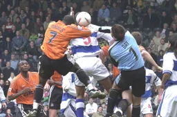 Adrian Forbes goes up for the ball