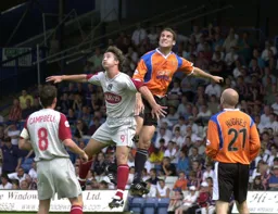 On the rise. Chris Coyne gets above Mick Boulding