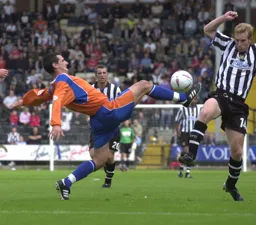 Matt Spring at full stretch to win the ball