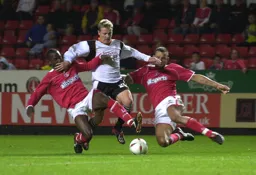 Gary McSheffrey holds off two defenders