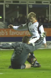 John Achterberg smothers the ball as Gary McSheffrey closes in