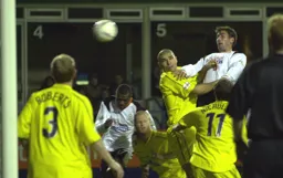 Russell Perrett gets above everybody to head in Town`s opening goal