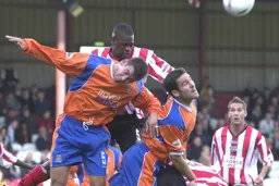 Russell Perrett and Chris Coyne attack the ball from a corner