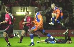 Paul Hughes is airbourne as he scores Town`s second goal
