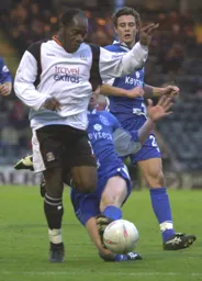 Adrian Forbes brushes off a would be tackler