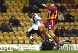 Adrian Forbes skips past the keeper to score Town`s first goal