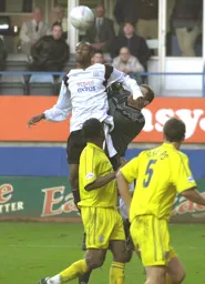 The ball is just to high for Emmerson Boyce to make contact