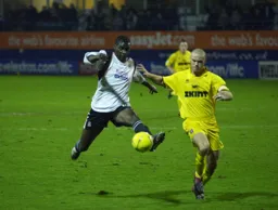 Enoch Showunmi takes the ball away from Danny Cullip