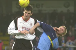 Matt Spring tangles with future Hatter Darren Currie