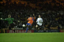 Jonny Brain moves out to block Enoch Showunmi