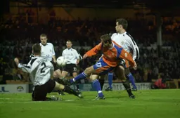 Peter Holmes tries a shot at goal