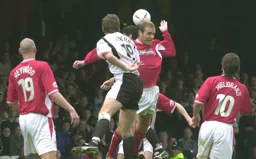 A cross into the penalty area eludes Steve Howard