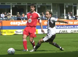 A puffed cheeked Ahmet Brkovic goes after the ball