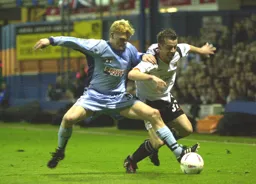 Keith Keane fights for the ball with Claus Jorgensen