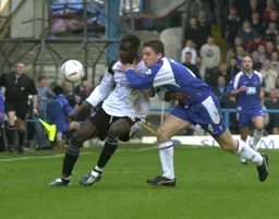 Kevin Dawson gets a strangle hold on Enoch Showunmi