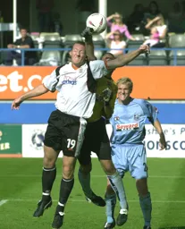 Steve Howard challenges the Cherries goalkeeper