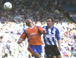 Ahmet Brkovic heads the ball backwards