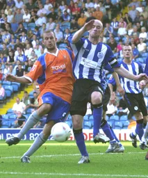 Rowan Vine attacks the ball