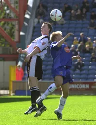 Kevin Foley wins a header