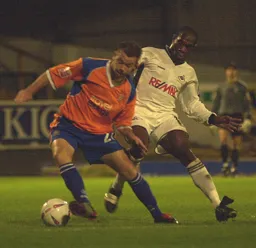 Keith Keane battles with former Hatter Adrian Forbes