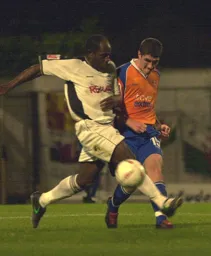 Stephen O'Leary gets a cross in past former Hatter Adrian Forbes