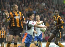 Steve Robinson shields the ball