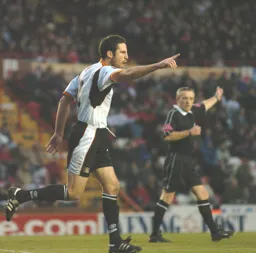 Chris Coyne signals his goal