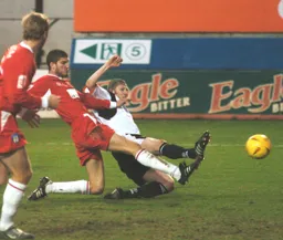 Kevin Nicholls slides in