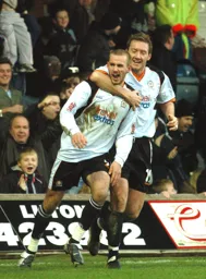 Rowan Vine receives the congratulations of Steve Howard