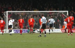 Kevin Nicholls sends the goalkeeper the wrong way from the spot