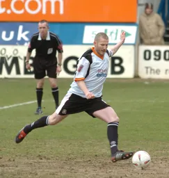 Kevin Nicholls scores the opener from the spot