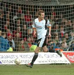Peter Holmes wheels away after netting the third goal
