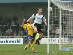 Steve Howard nods in the Town's third goal from close range