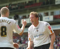 Steven Howard celebrates with Kevin Nicholls