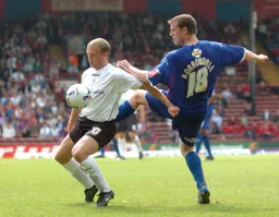 Warren Feeney controls the ball
