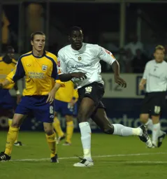 Enoch Showunmi gets if front of his marker