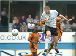 Kevin Nicholls wins a header