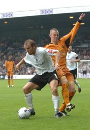 Paul Underwood shields the ball from a Wolves player